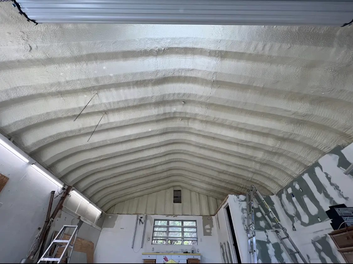 Spray polyurethane foam applied to the underside of a metal roof deck in Rigby